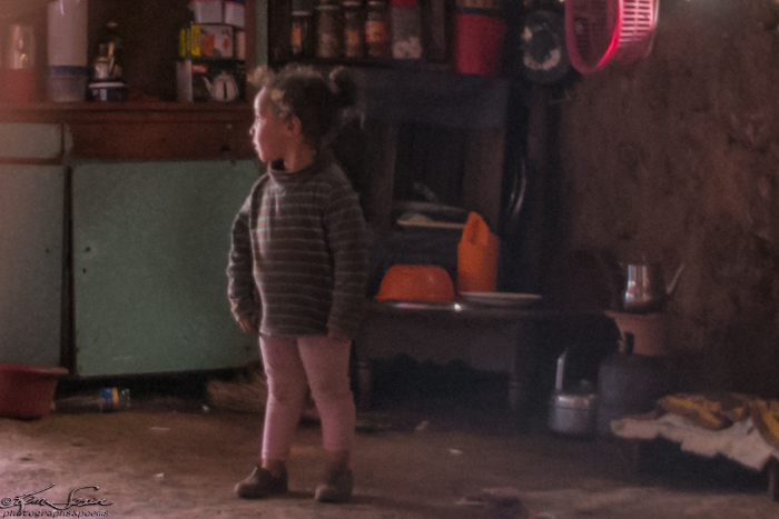 Middle Atlas Mountains, Morocco 9-14-14, Semi-Nomad Family: Daughter watches us and is quite curious. Cans and jars of food on the shelves.