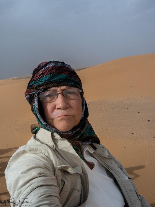 Morocco 9-15 to 17-2014, Morocco 9-15 to 9-17-2014, Sahara near Merzouga: I try a selfie, looking sandy and quite wizened by the desert.  Took so much concentration to hold out the camera while staying ON the camel that I forgot to smile.