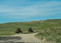 Peaceful Prairie Rd:Horses, small 4-wheelers, and now these monster tractors.