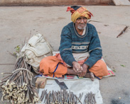 Varanasi - Selling sticks, maybe something for a ceremony?