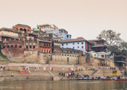 Ghats on the Ganges: A larger view of a ghat  (steps leading to a river) showing the extensive building along the shore.