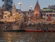 Varanasi: Looking toward a ritual bathing area, the umbrellas indicate a Brahmin willing to give religious and life consultation.