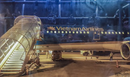 We fly form Hanoi to Hue on Vietnam Airlines.  Photo from the airport bus in Hue.