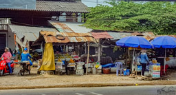 Perhaps I shouldn't say this, but it is my observation that so many street markets look exactly the same in every developing country.  If it weren't for the conical straw hat, this could be anywhere in the world.