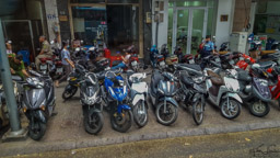 My camera broke and I had a local shop repair it in Saigon.  As I walked to get the camera, I became curious about where all those scooters go during the day.  A lot of them just sit on the sidewalk, but I also found...