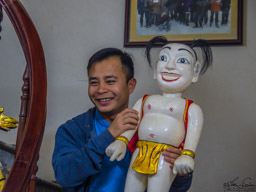 We visited the home of a master water puppeteer.  Our guide, An, is holding one of the puppets.