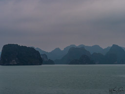HaLong Bay the next morning, in a dark sky.