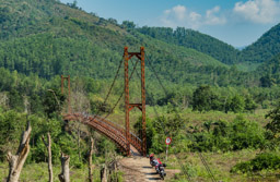 Pedestrian bridge over a river on the way to Dalat.
