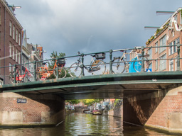 Amsterdam canals with the ever-present bicycles parked on bridges.