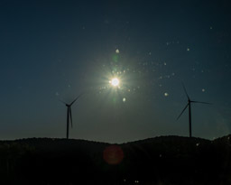 We saw both wind turbines and solar panels on our drives. (Taken through a window).